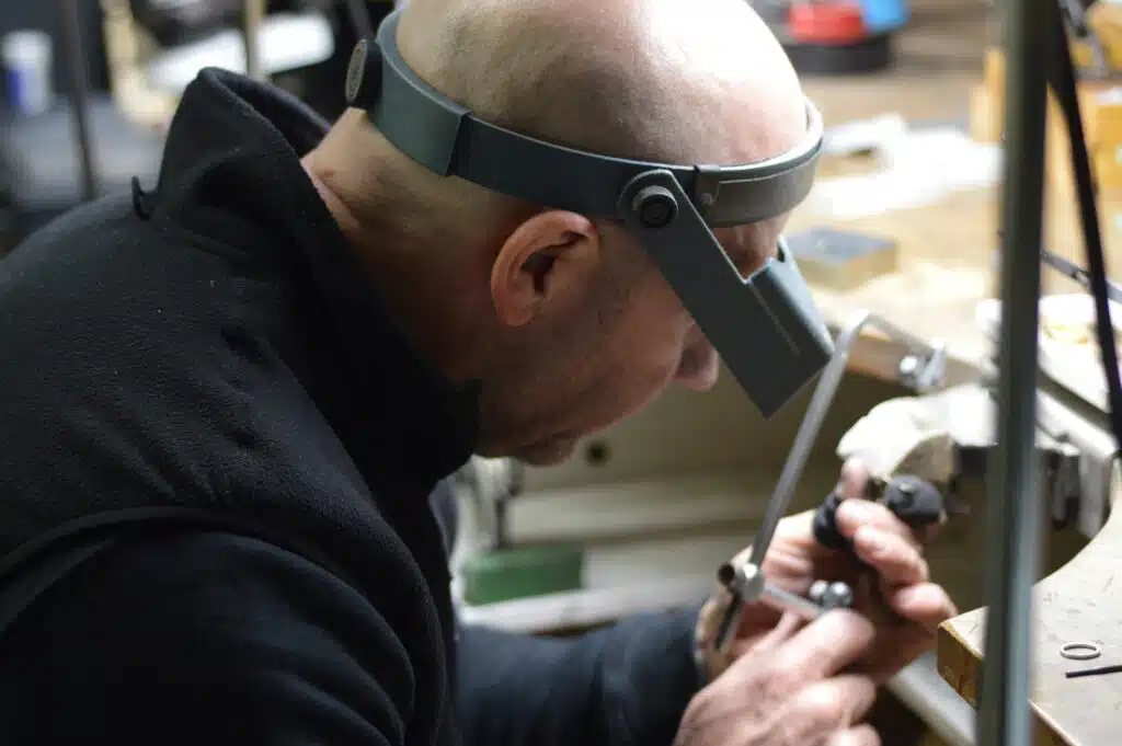 Lee working on jewellery bench